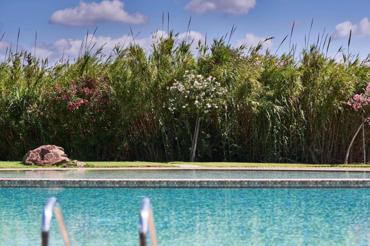 Baia Di Chia Resort Sardinia, Curio Collection By Hilton Exterior foto